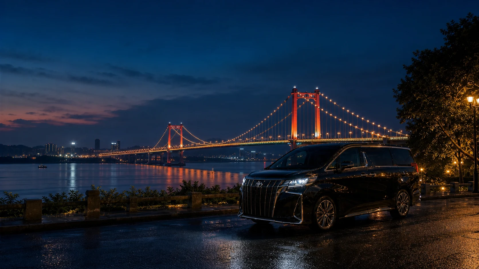 Executive MPV overlooking the illuminated Humen Bridge in Dongguan at night