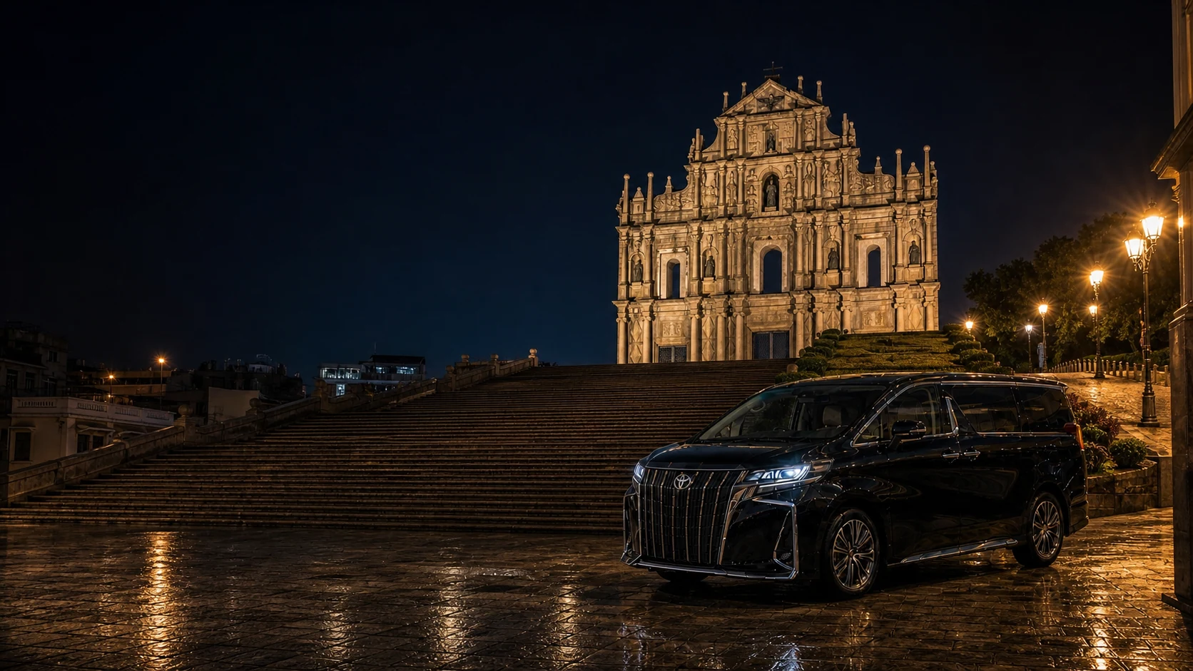 Executive MPV near the illuminated Ruins of St. Paul in Macao at night